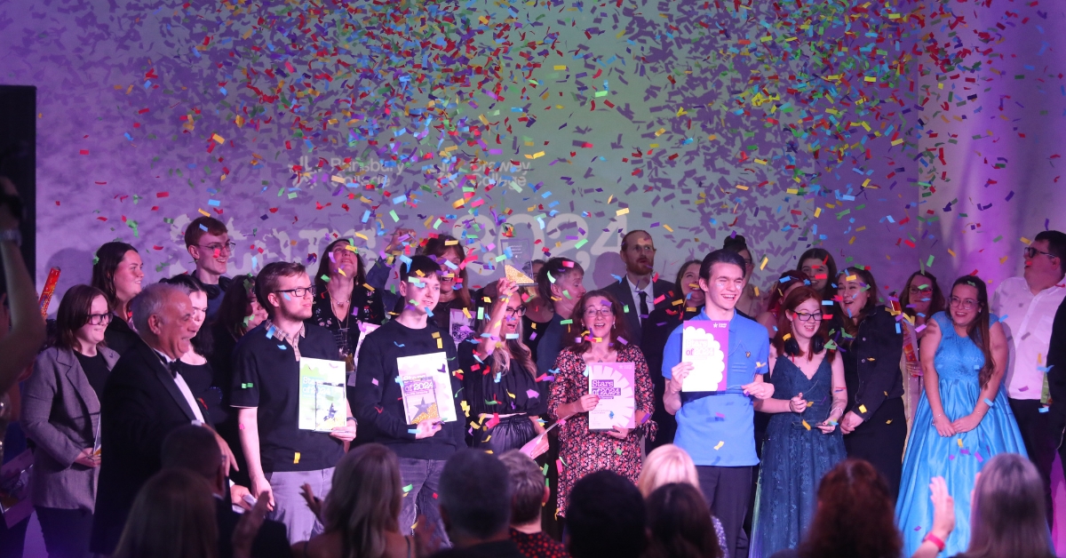 Our Star award winners on stage celebrating