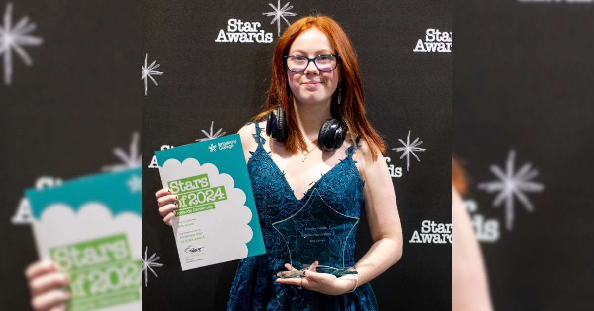 Our Brightest Star, Mia, stood with her award and certificate